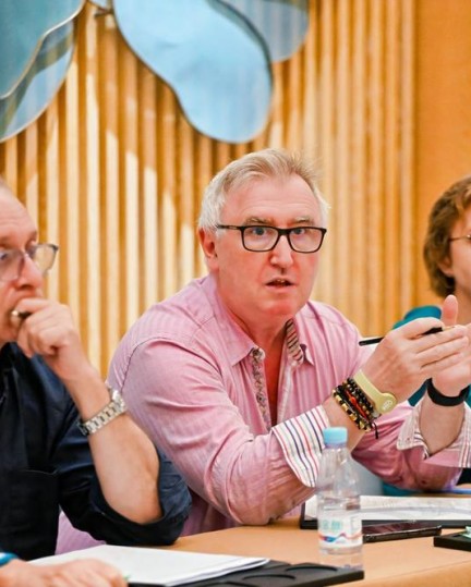 Chair moderating discussion during meeting